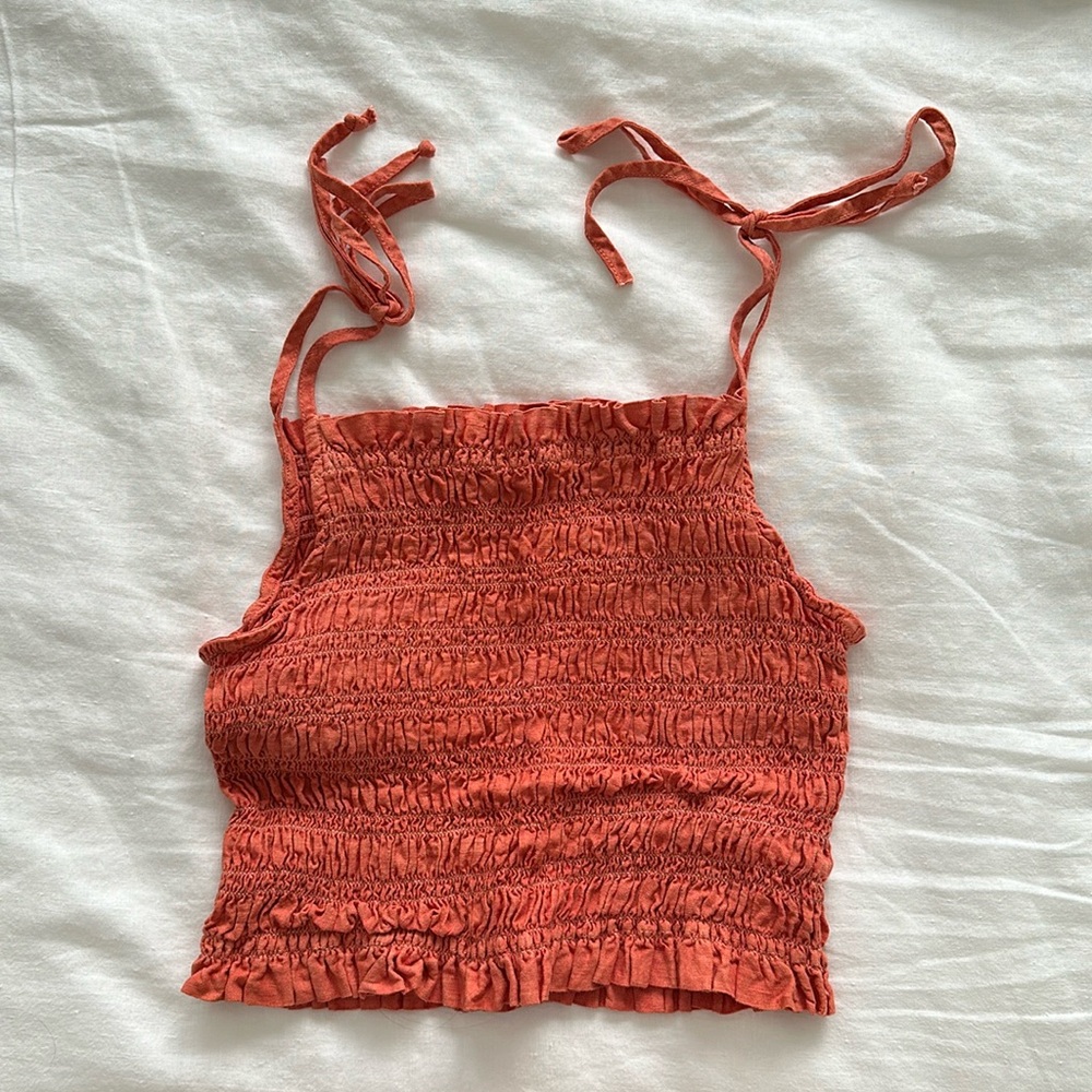 orange tie tank top. from revolve. barely worn. adjustable tie straps.